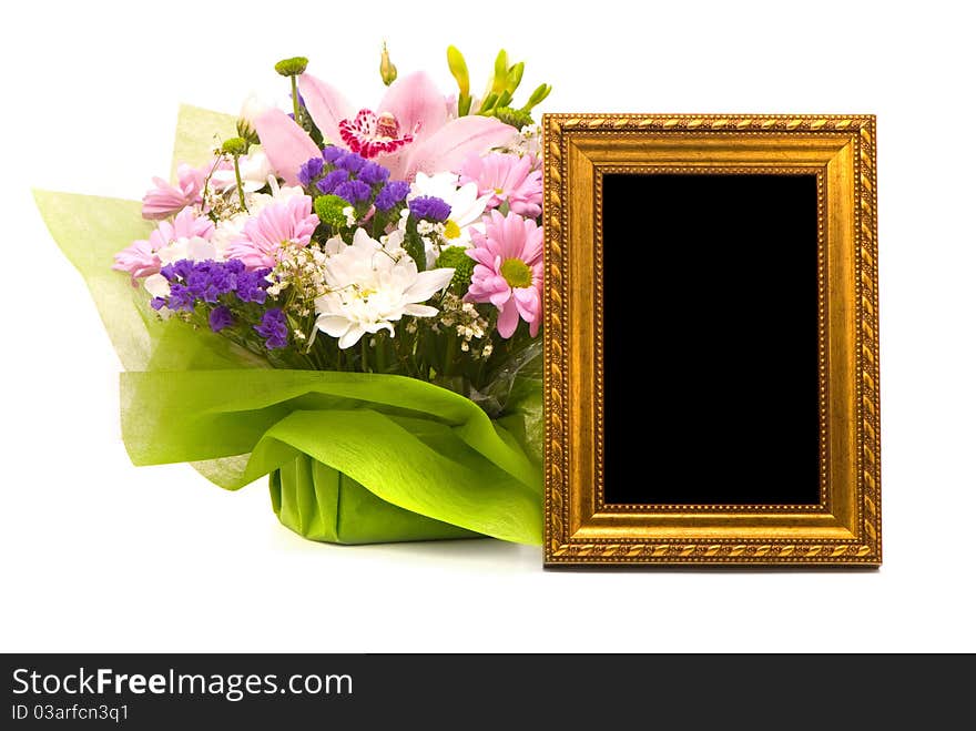 Beautiful bouquet and golden frame on a white