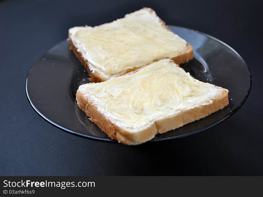 Image two slices of bread with butter and honey. Image two slices of bread with butter and honey