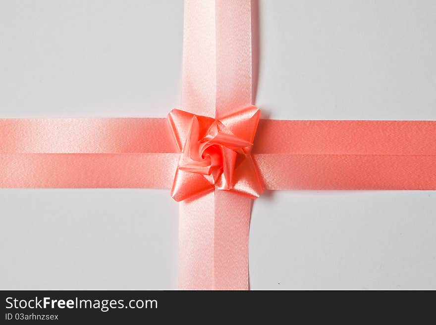 Beautiful pink bow on white background