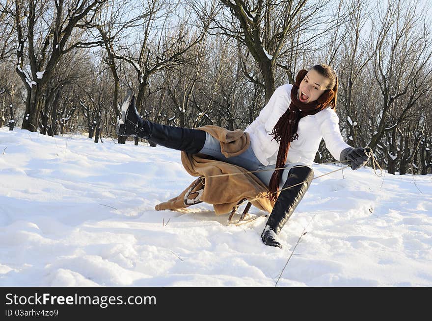 Girl having fun on sledge