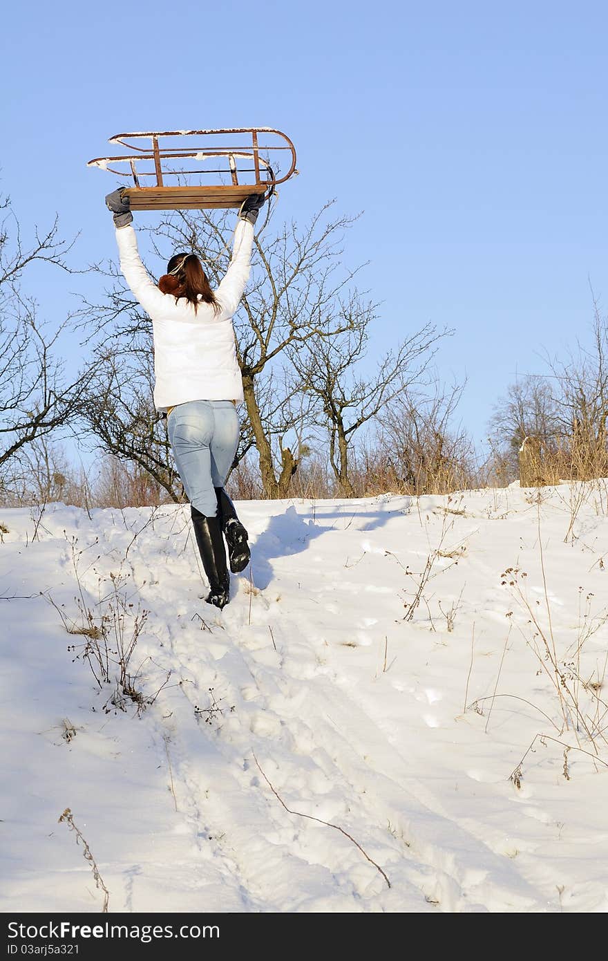 Woman carrying sledge