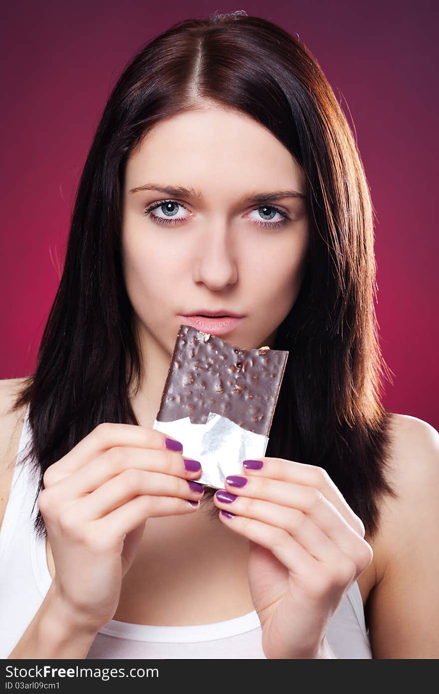 Portrait of young woman with chocolate