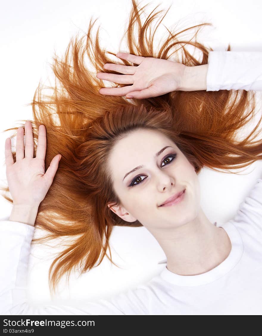 Pretty red-haired woman in white nightie