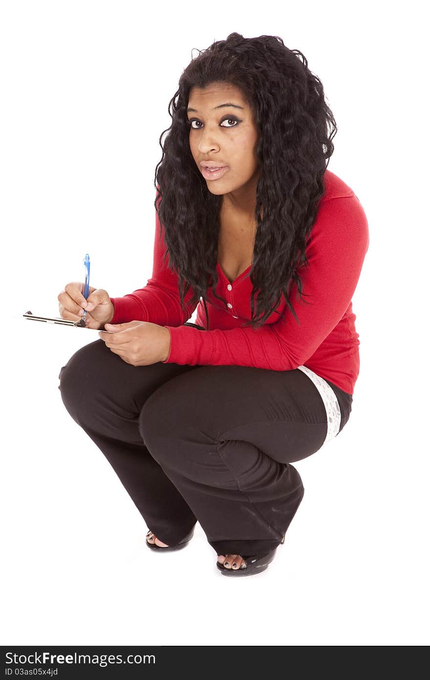 An African American woman is taking notes. An African American woman is taking notes.