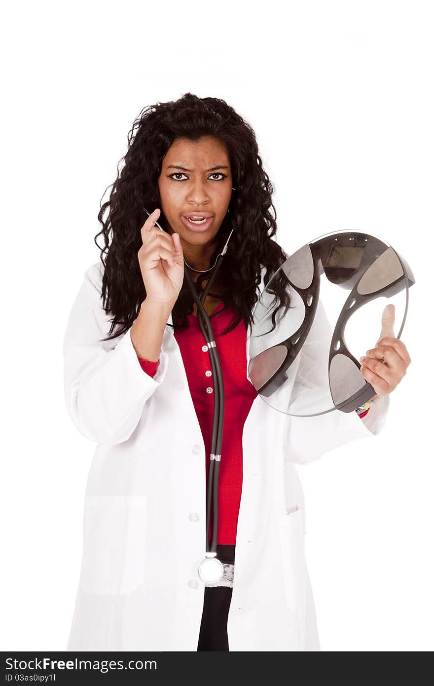 A woman doctor is mad and holding the bathroom scales. A woman doctor is mad and holding the bathroom scales.