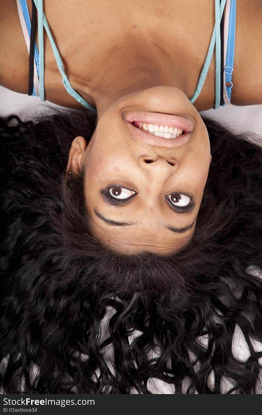 A woman is upside down with her hair fanned out. A woman is upside down with her hair fanned out.