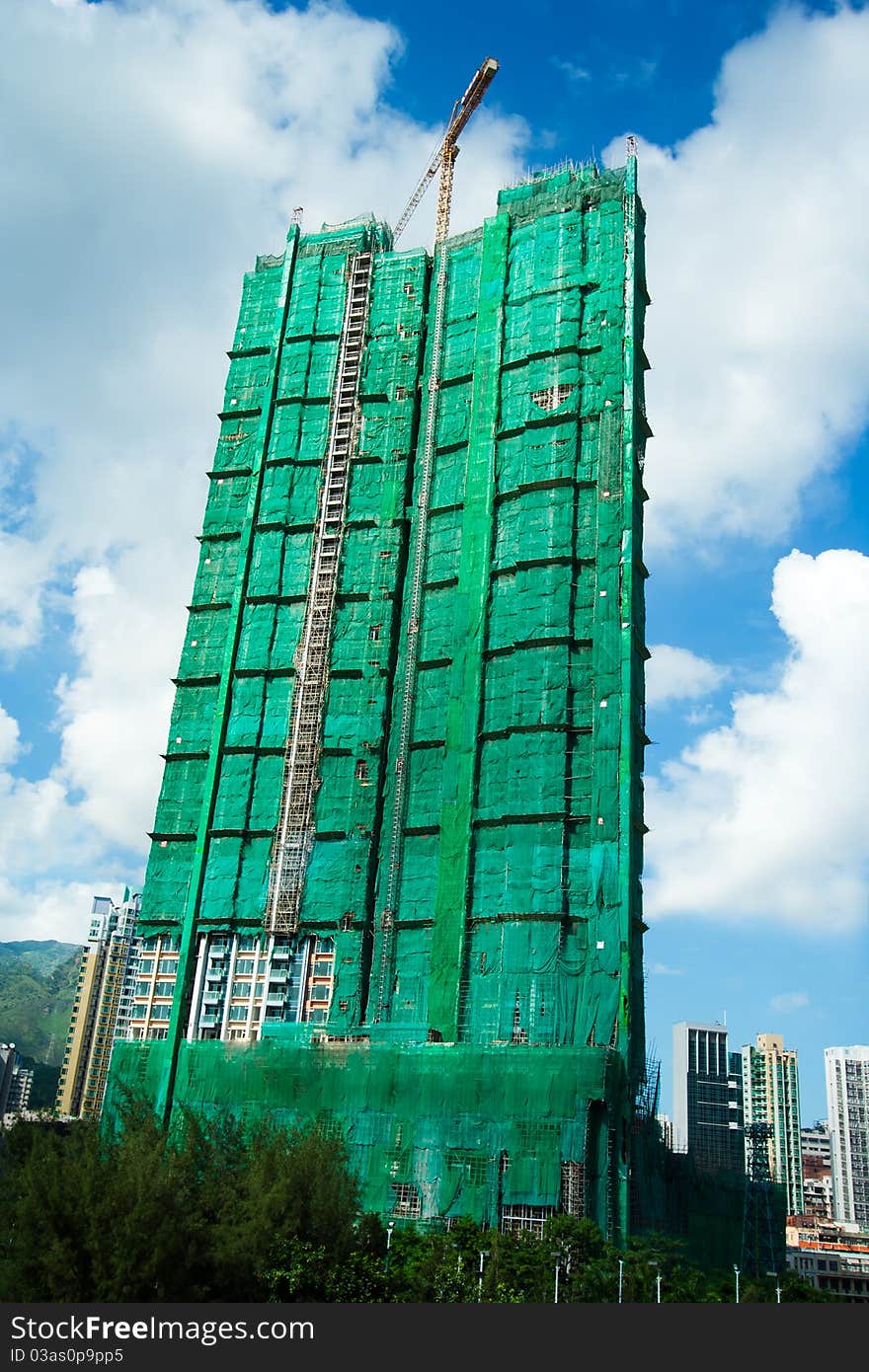 Angled shot of an office building during being construction site. Angled shot of an office building during being construction site