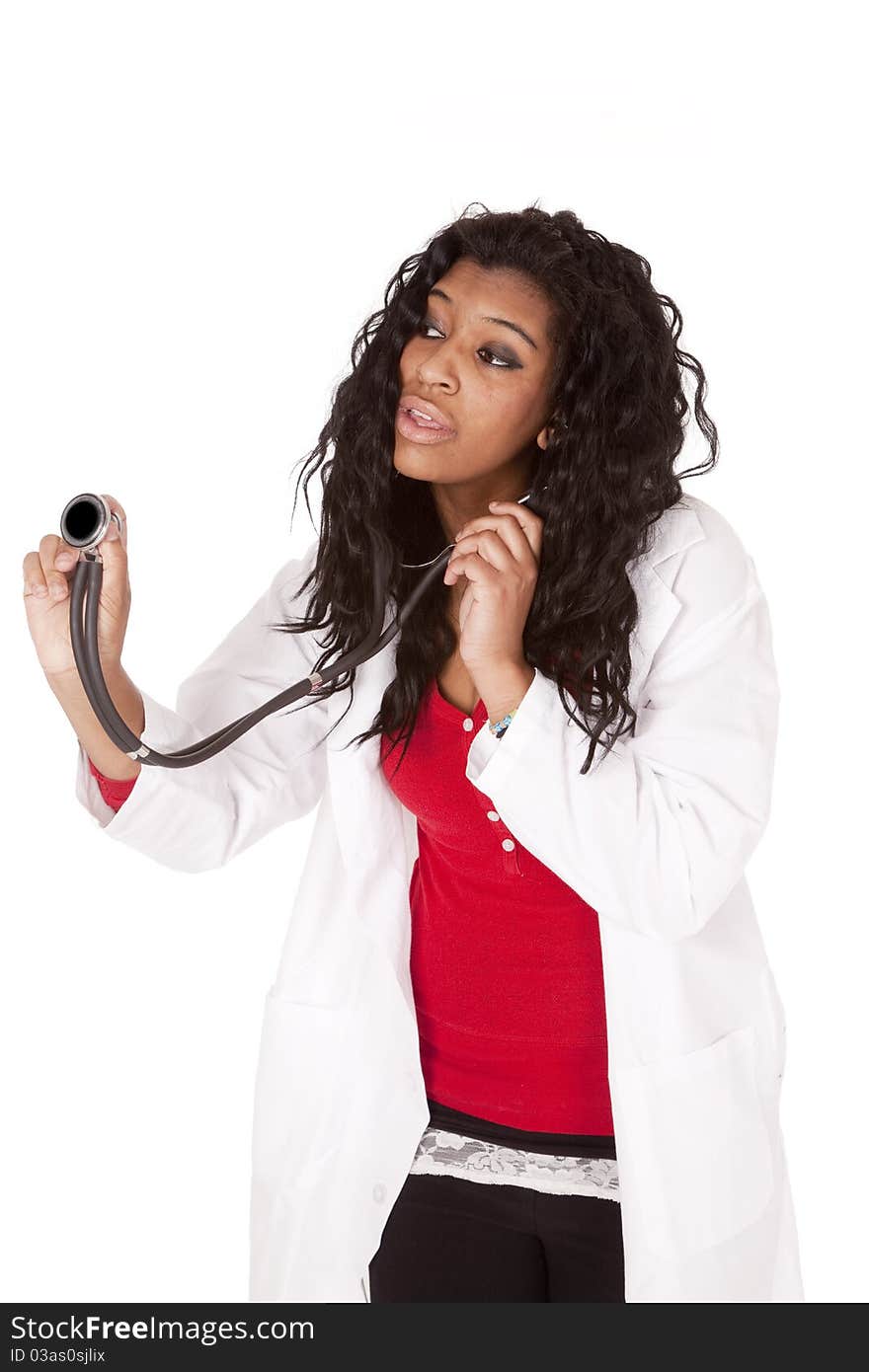 A woman doctor is holding out her stethoscope. A woman doctor is holding out her stethoscope.