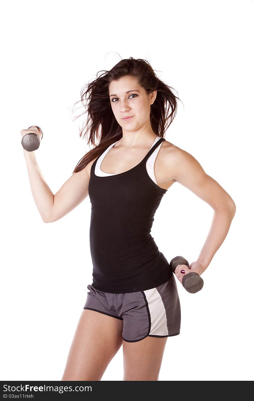 A woman working out is slightly smiling. A woman working out is slightly smiling.