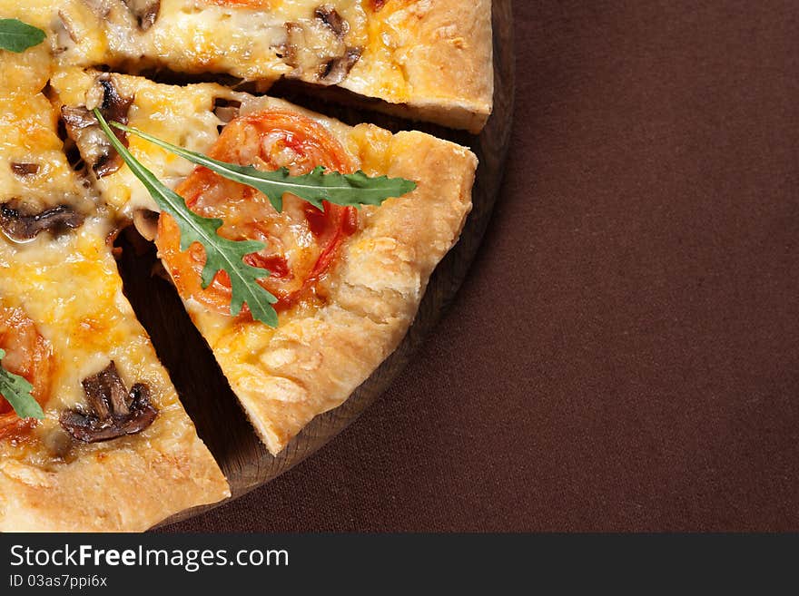 Fresh baked pizza with mushroom, tomatoes and rucola. Fresh baked pizza with mushroom, tomatoes and rucola