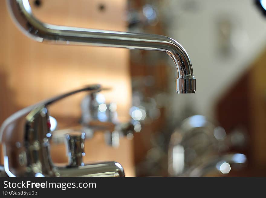 Silver metallic water tap in bathroom