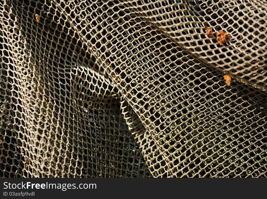 Old and decrepit fish net close up. Old and decrepit fish net close up