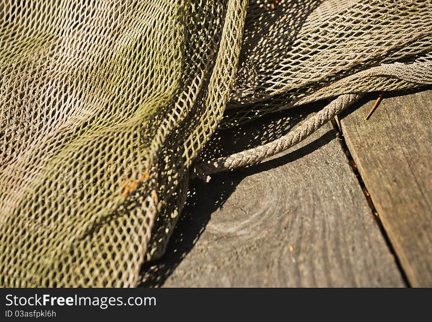 Old and decrepit fish net close up. Old and decrepit fish net close up