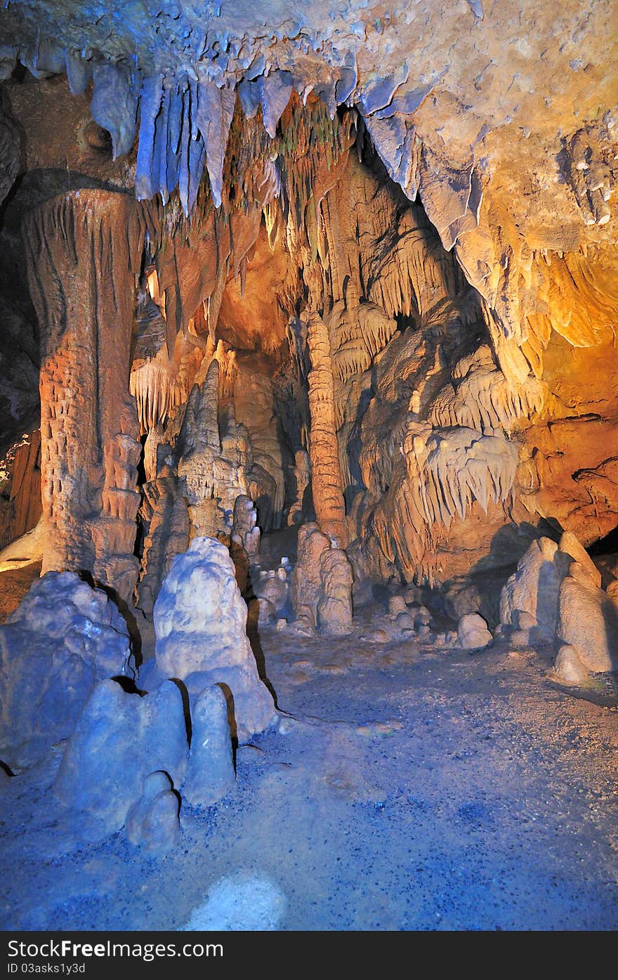 Red blue green rocks and pillars made up of minerals inside luray caves