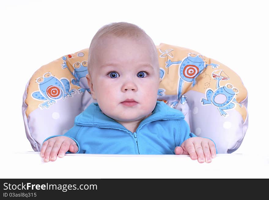 in a baby chair on a white background. in a baby chair on a white background