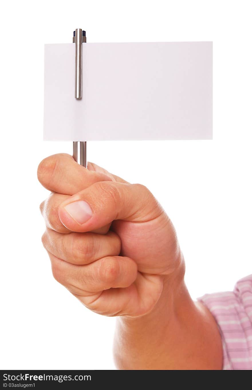 Hand holding a pen and a white card over white background