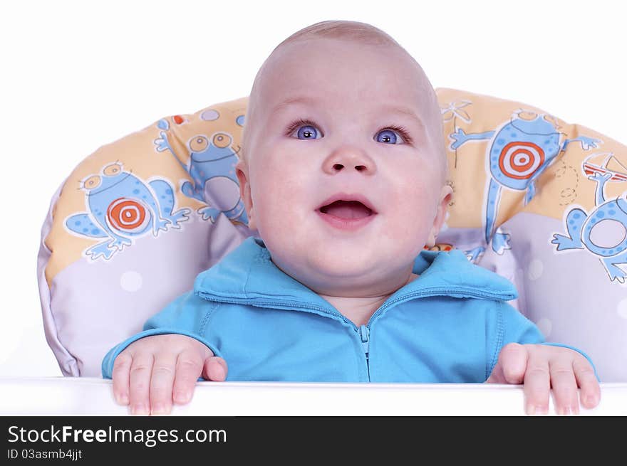 in a baby chair on a white background. in a baby chair on a white background