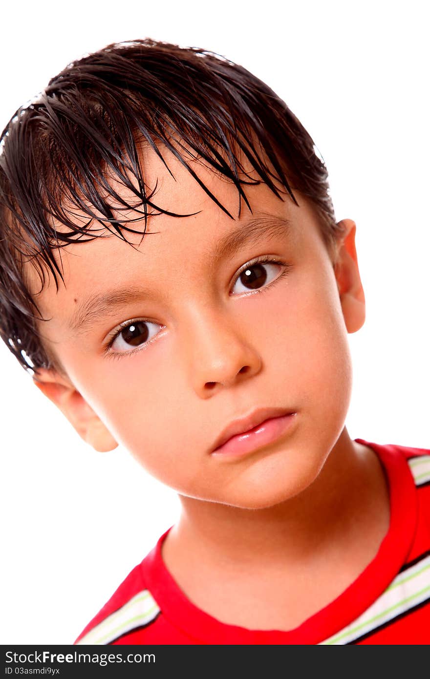 Boy looking at the camera over white background