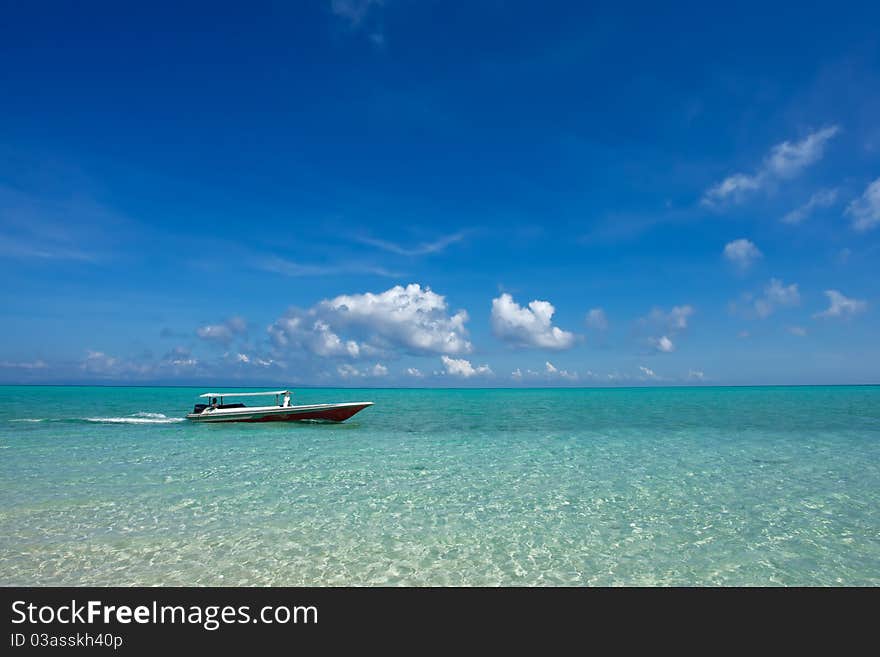 Small Boat At Beautiful Ocean