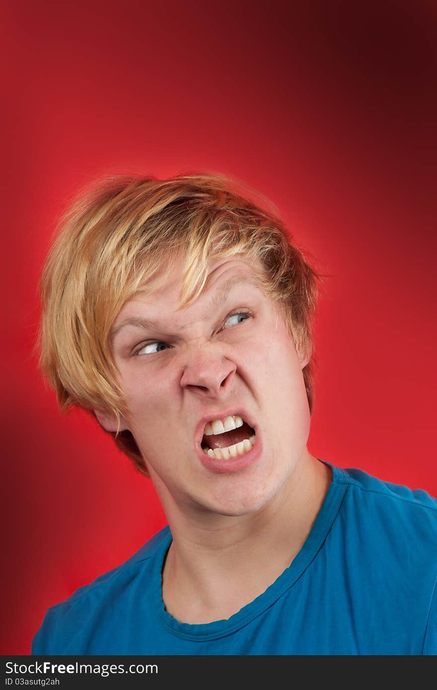 Man looking agressive and ready to fight on red background. Man looking agressive and ready to fight on red background