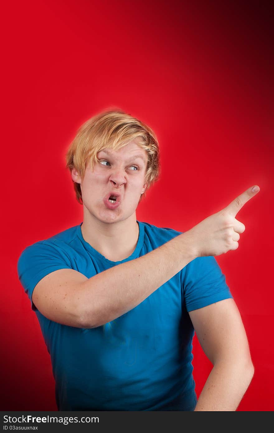 Man looking agressive and ready to fight on red background. Man looking agressive and ready to fight on red background