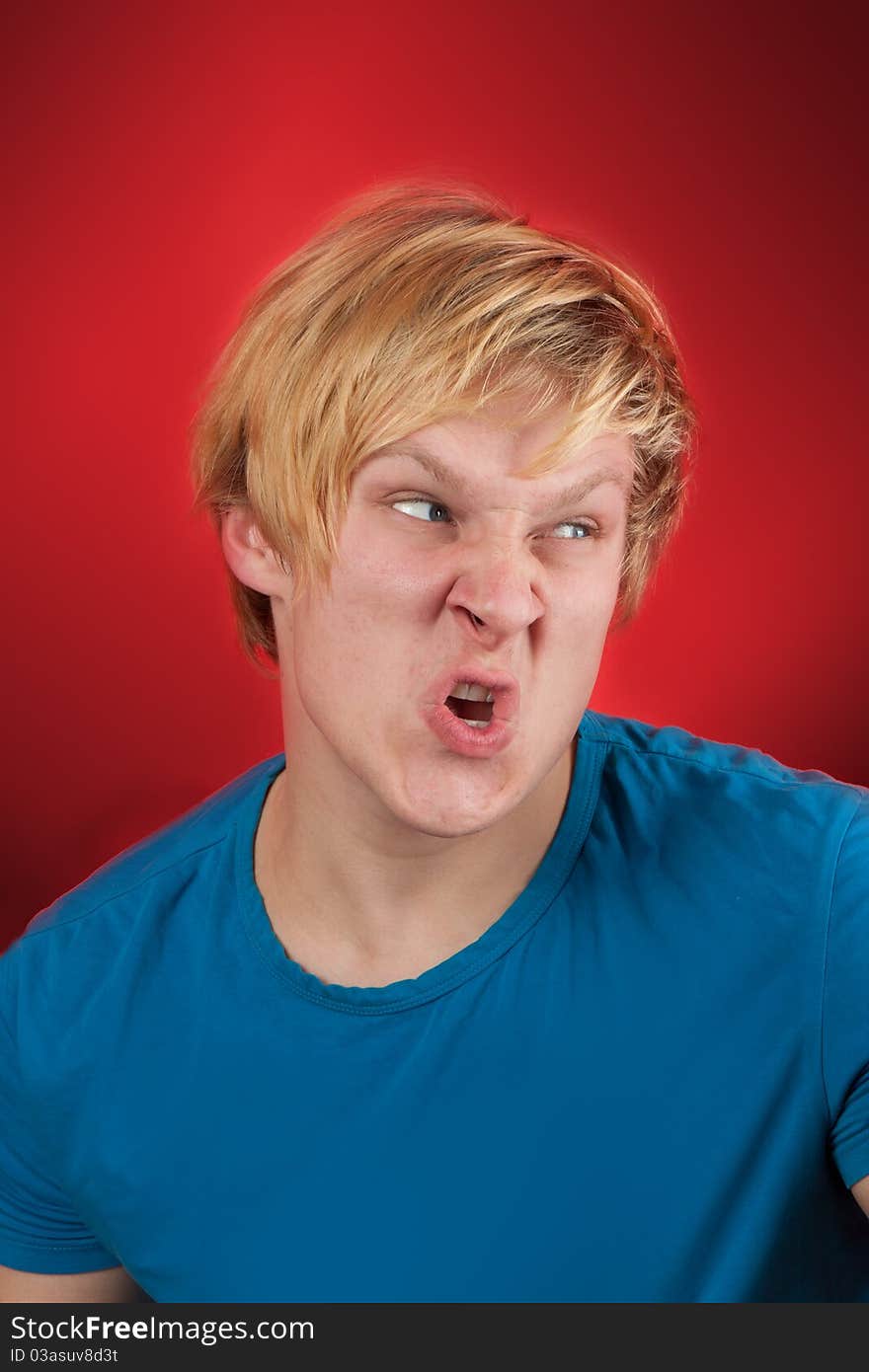 Man looking agressive and ready to fight on red background. Man looking agressive and ready to fight on red background