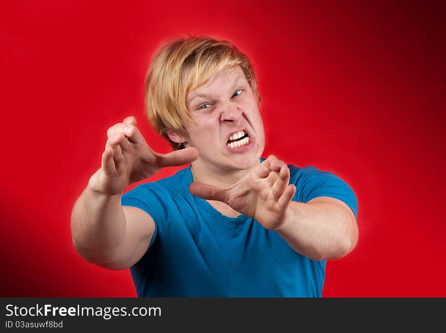 Man reaching to hurt someone unlucky on red background. Man reaching to hurt someone unlucky on red background