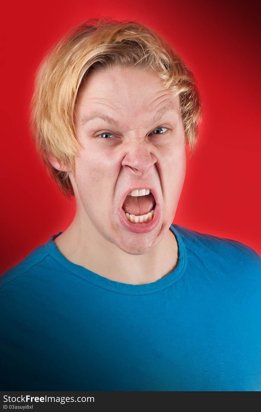 Man looking agressive and ready to fight on red background. Man looking agressive and ready to fight on red background