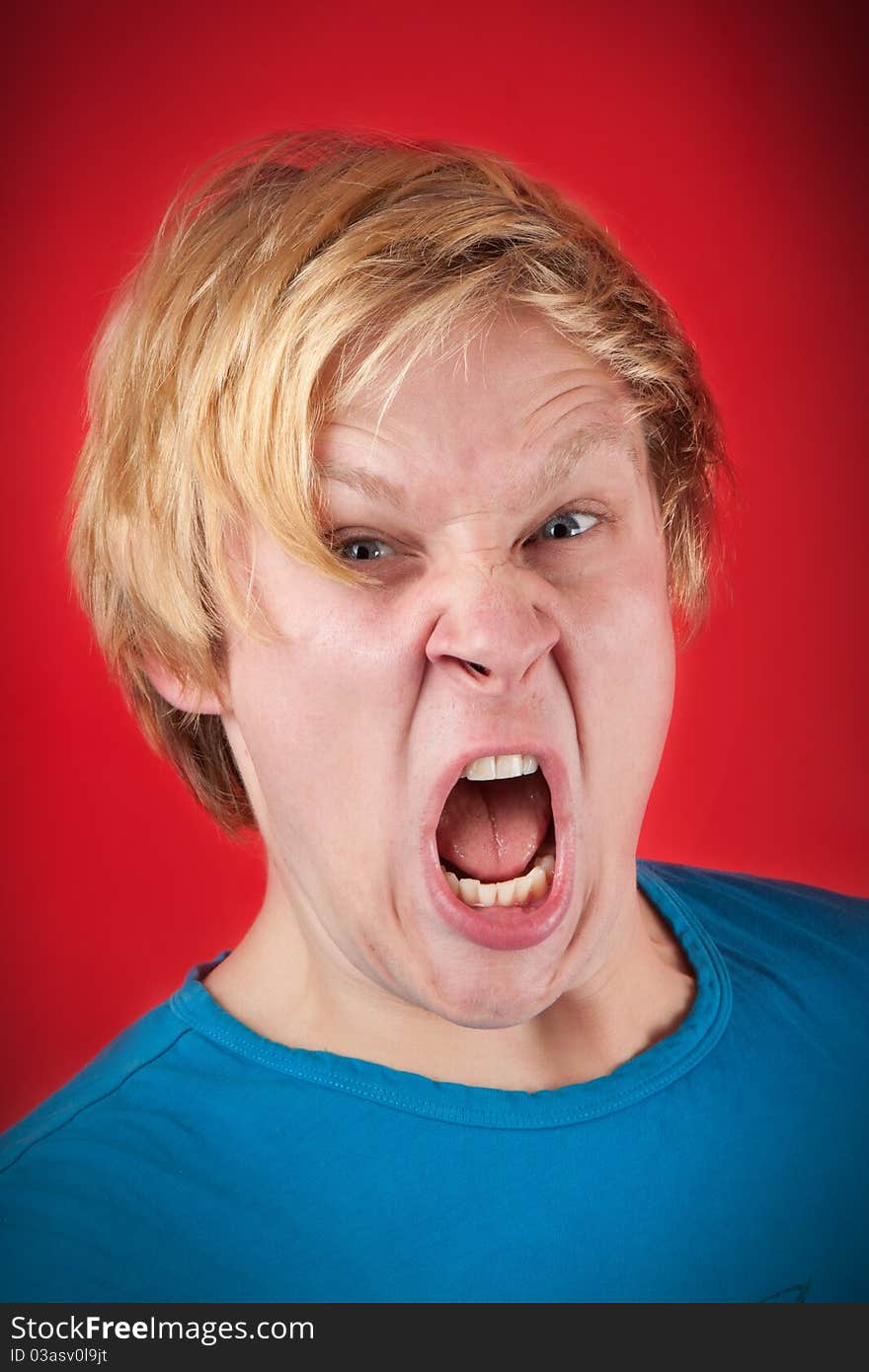 Man looking agressive and ready to fight on red background. Man looking agressive and ready to fight on red background