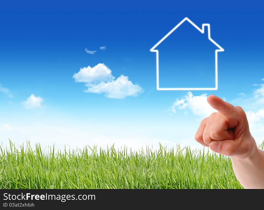 House in hand isolated over a cloudy sky background. House in hand isolated over a cloudy sky background