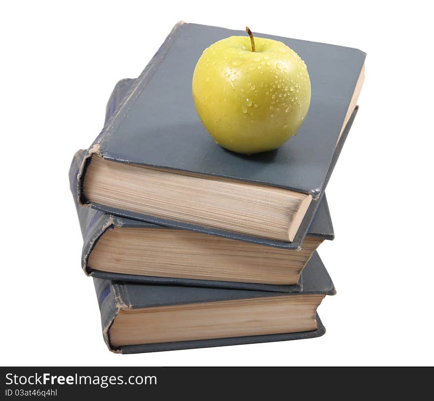 Three old books, lying the friend on the friend, with an apple on the isolated white background. Three old books, lying the friend on the friend, with an apple on the isolated white background