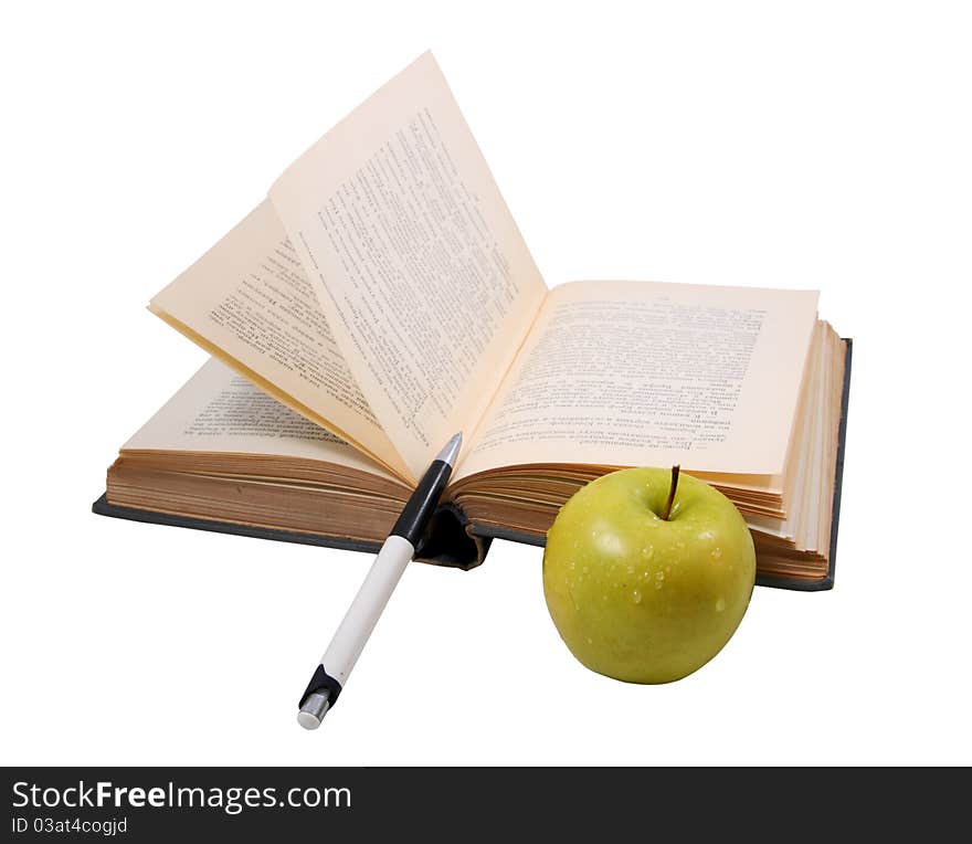 The old open book with a pen and a wet apple on the white isolated background. The old open book with a pen and a wet apple on the white isolated background