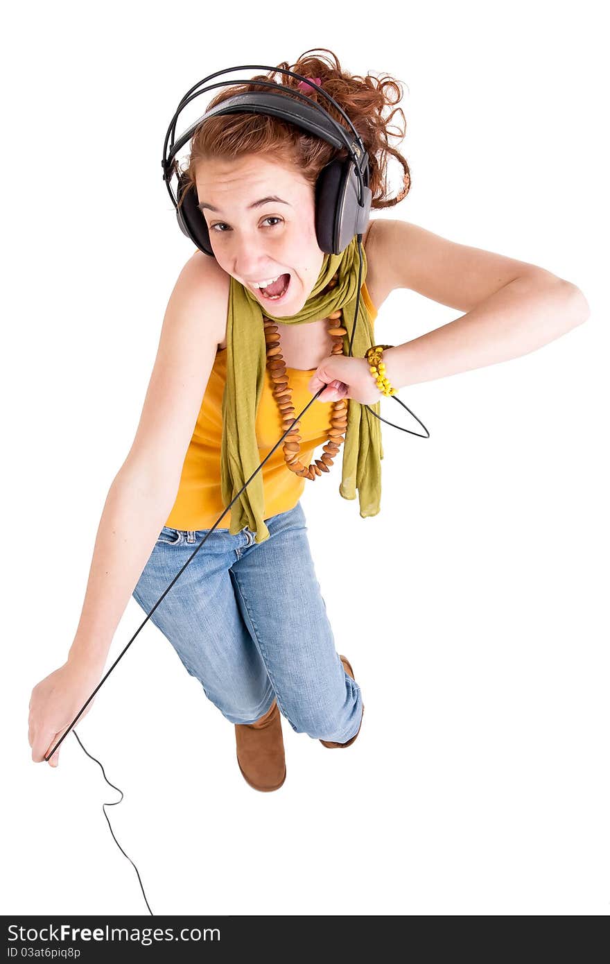 Beautiful teen girl listening music and danceing