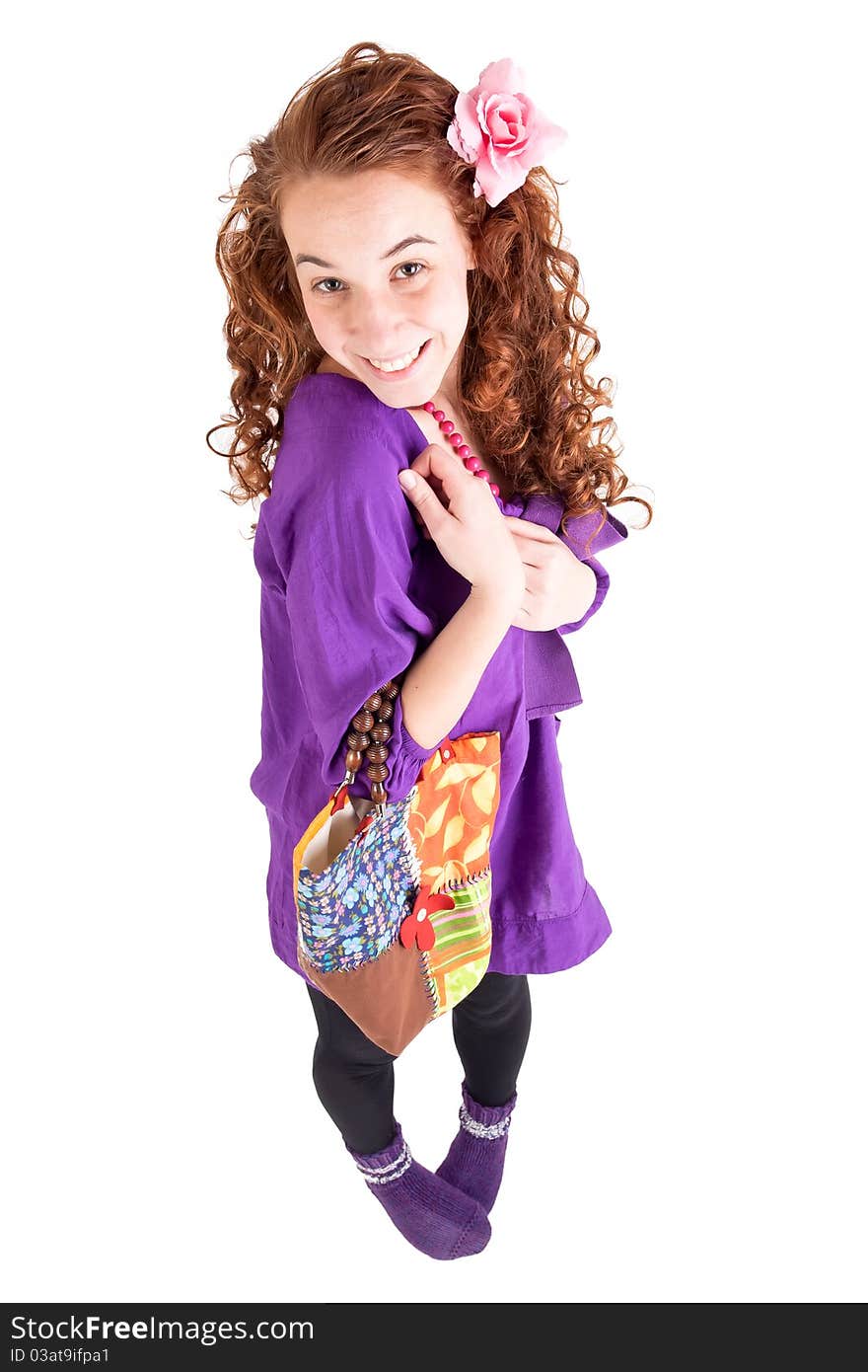 Beautiful teen girl with a little bag on white background