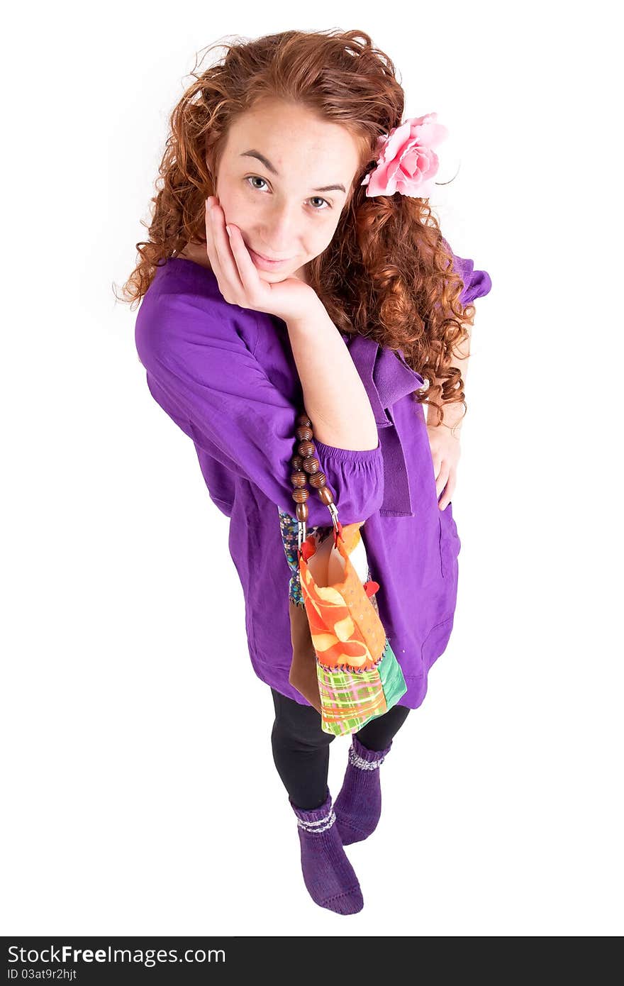 Beautiful teen girl with a little bag on white background