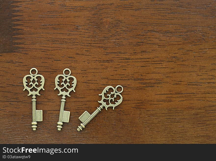 Old key on a wooden table