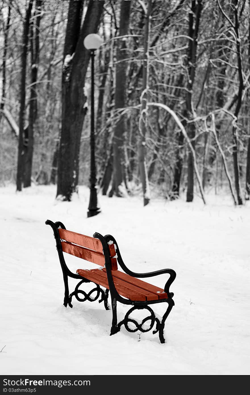 Benches in the winter park filled in with the snow