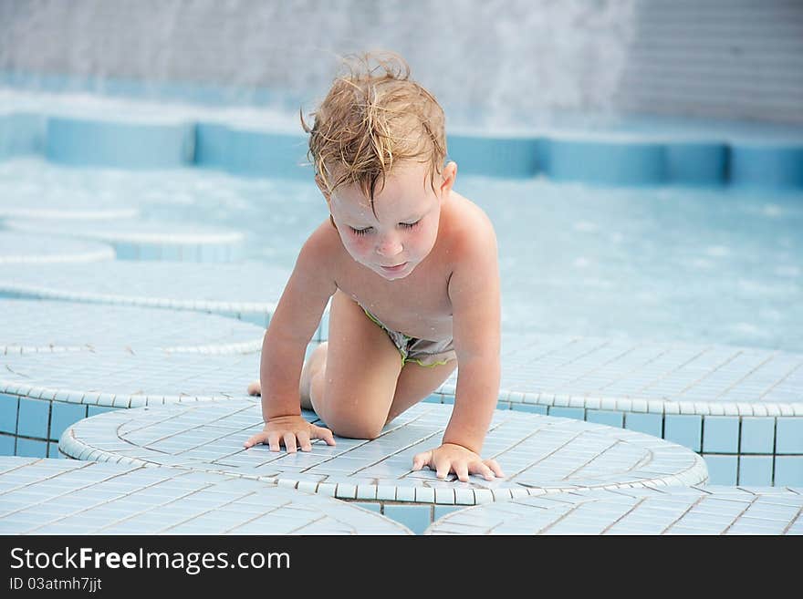 Child in outdoor pool