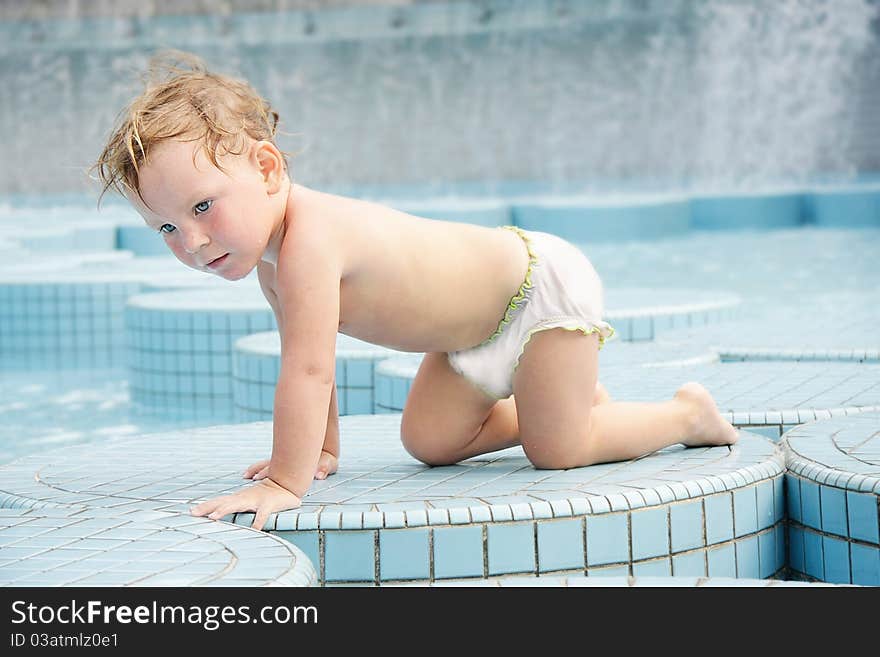 Child in outdoor pool