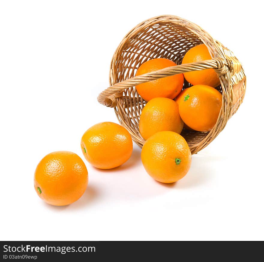 Oranges spilling out of a basket.