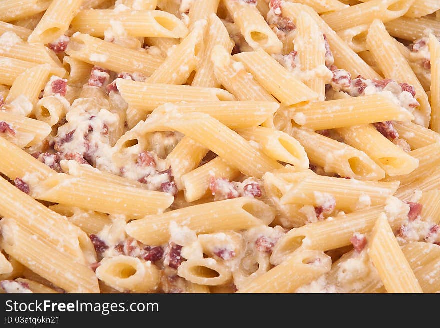 Closeup of italian pasta with bacon and cheese