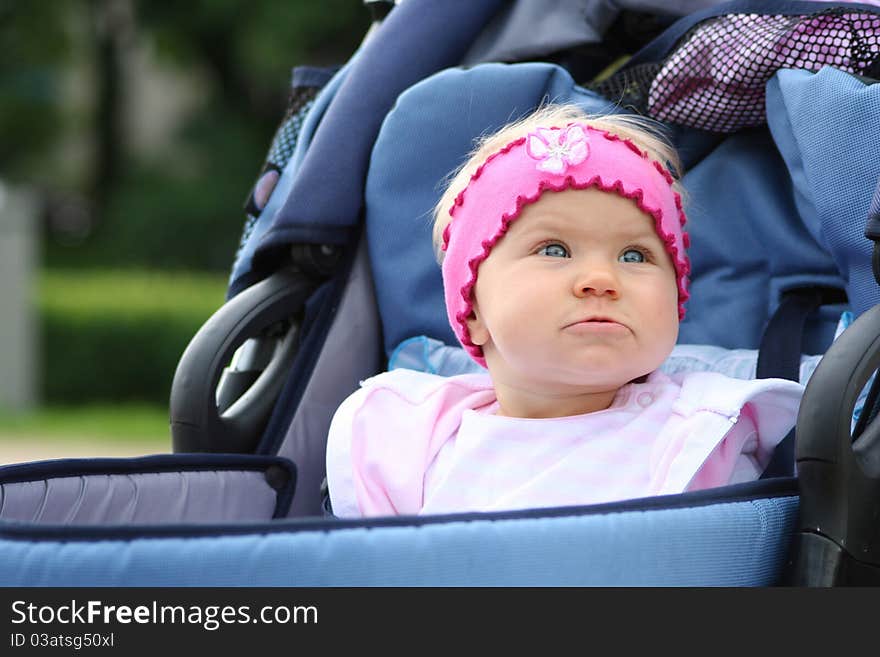 Delight of the little girl in pram. Delight of the little girl in pram