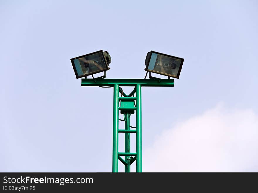 Spot light pole at stadium over sky background. Spot light pole at stadium over sky background.