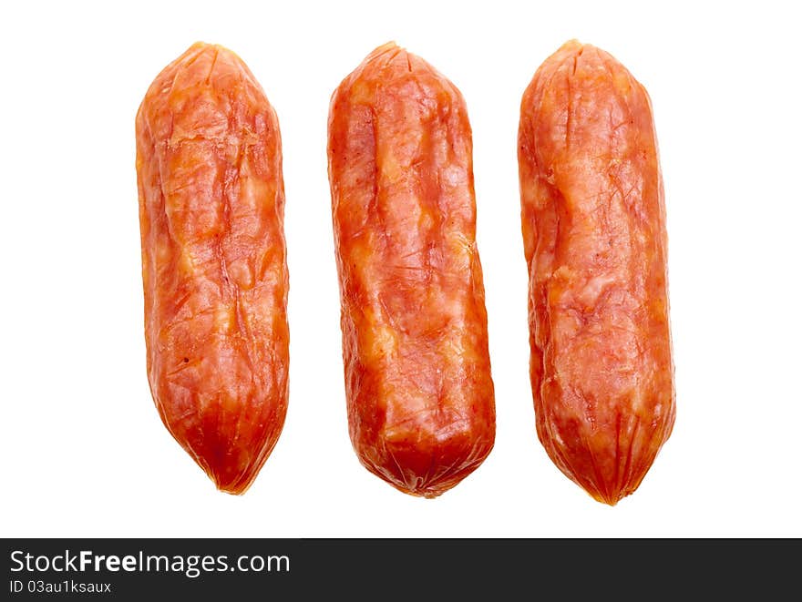 Small spicy salami snacks isolated on a white background