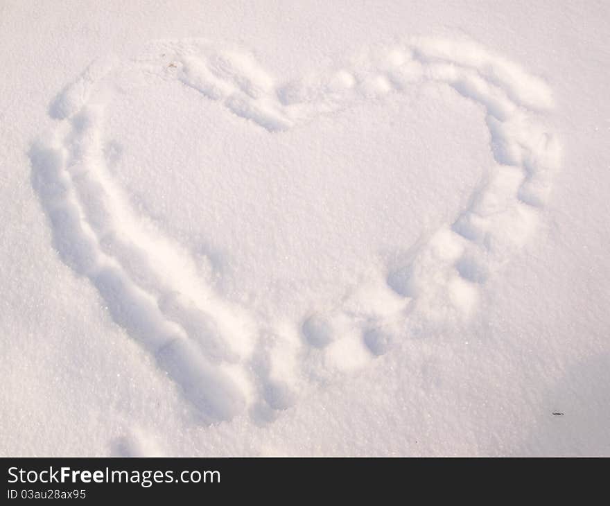 White heart in snow landscape