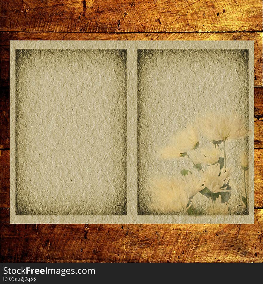 Textural old flower paper on a wooden background