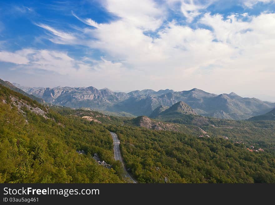 Mountain Landscape with a Road through the Woods. Mountain Landscape with a Road through the Woods