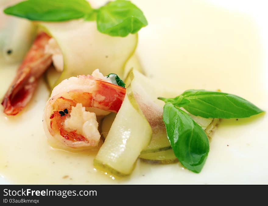 Studio close-up photography of a fried shrimp in a pear tree and decorated with sweet sauce mint leaves