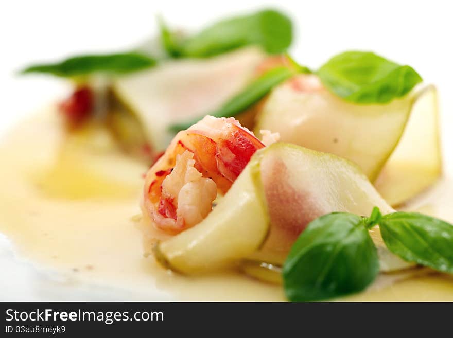 Studio close-up photography of a fried shrimp in a pear tree and decorated with sweet sauce mint leaves