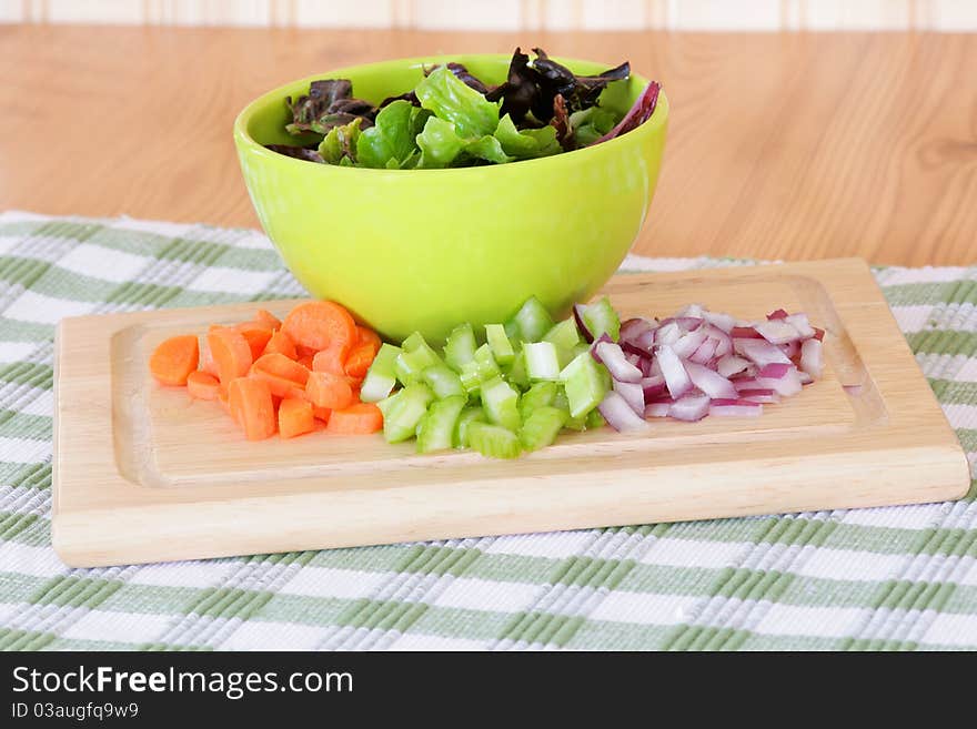 Salad ingredients of lettuce, carrot, celery and onion